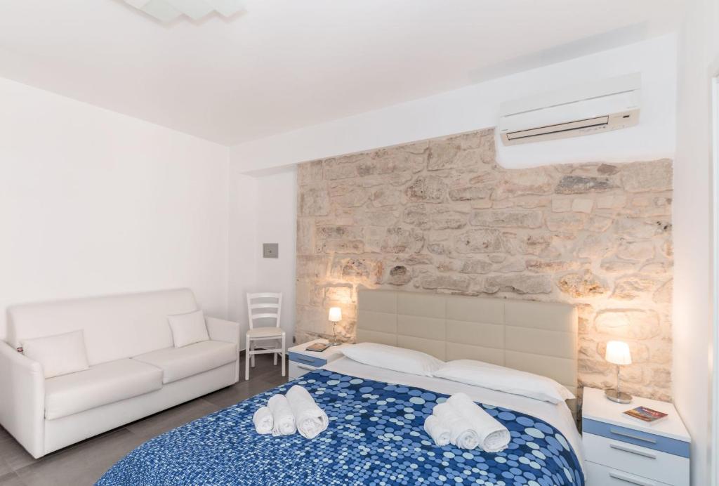 Postel nebo postele na pokoji v ubytování B&B Bianco E Blu