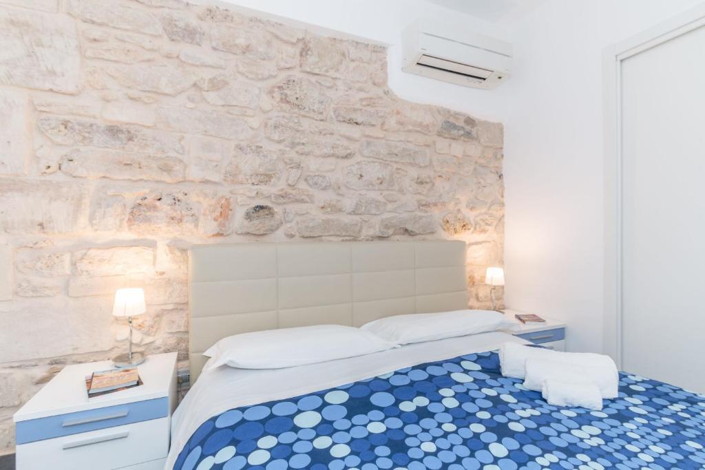 Postel nebo postele na pokoji v ubytování B&B Bianco E Blu