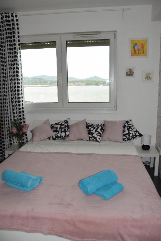 Postel nebo postele na pokoji v ubytování Panorama Apartman