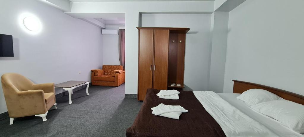 Postel nebo postele na pokoji v ubytování Hotel Genatsvale