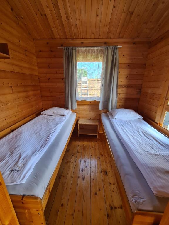 Postel nebo postele na pokoji v ubytování Domki Gościniak