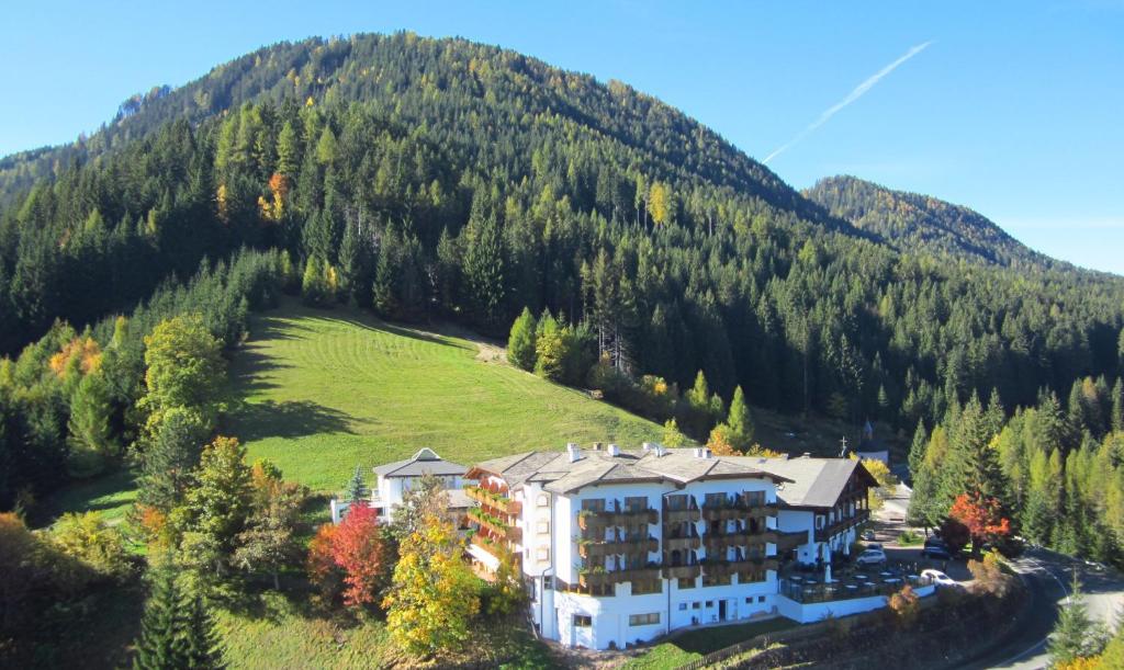 an aerial view of a hotel on a mountain at Ganischgerhof Mountain Resort & Spa in Nova Ponente