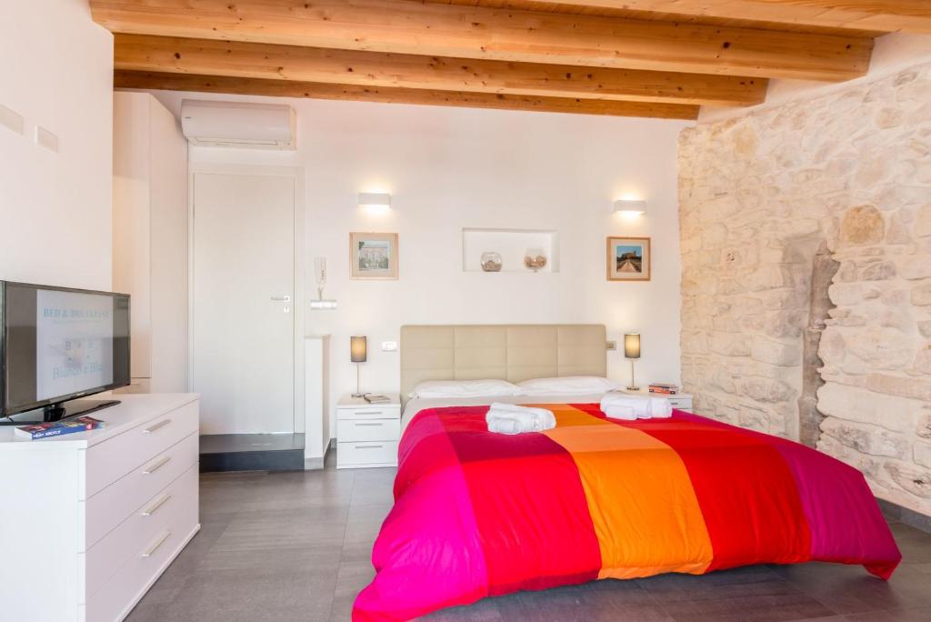 Postel nebo postele na pokoji v ubytování B&B Bianco E Blu