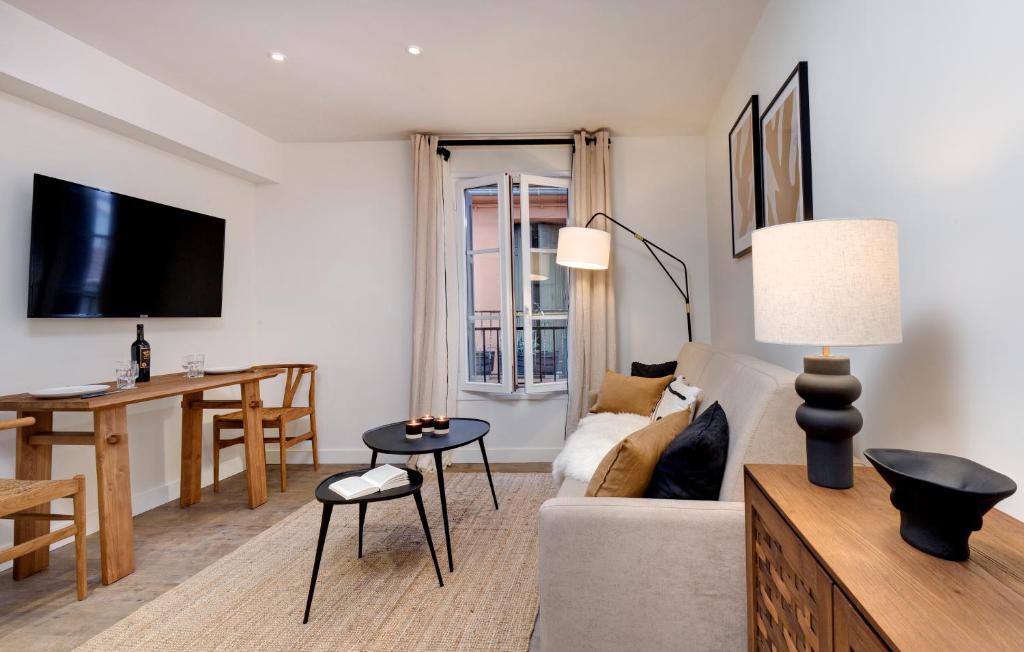 Televízia a/alebo spoločenská miestnosť v ubytovaní Les Appartements de Collioure