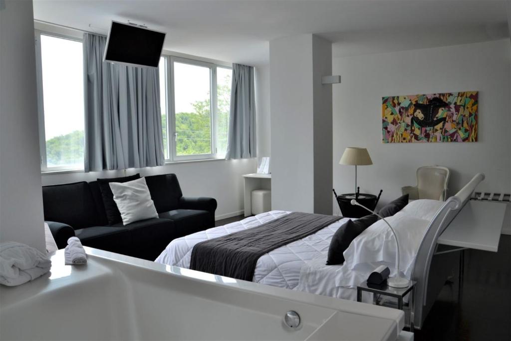 Postel nebo postele na pokoji v ubytování Hotel iDesign