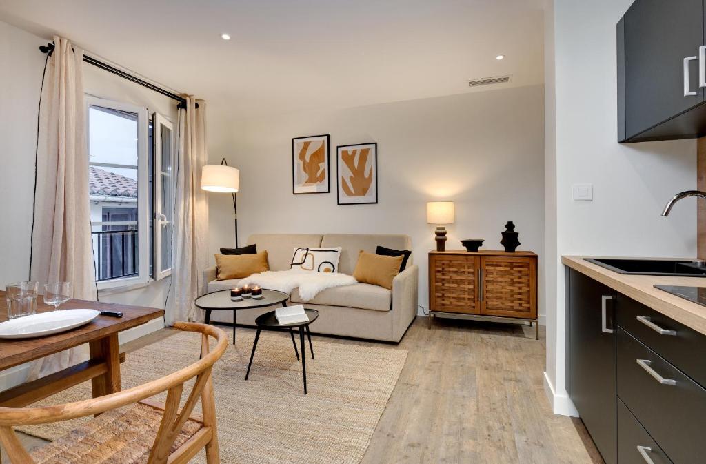 Televízia a/alebo spoločenská miestnosť v ubytovaní Les Appartements de Collioure