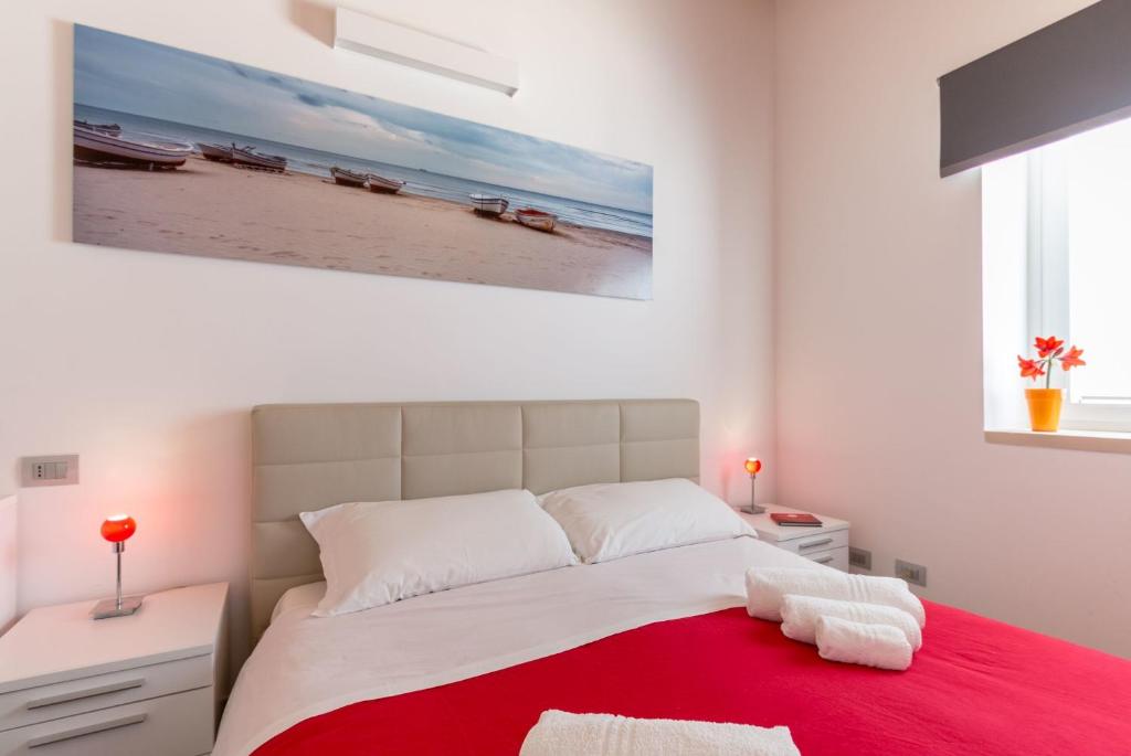 Postel nebo postele na pokoji v ubytování B&B Bianco E Blu
