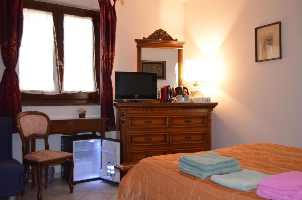 Letto o letti in una camera di B&B Belvedere