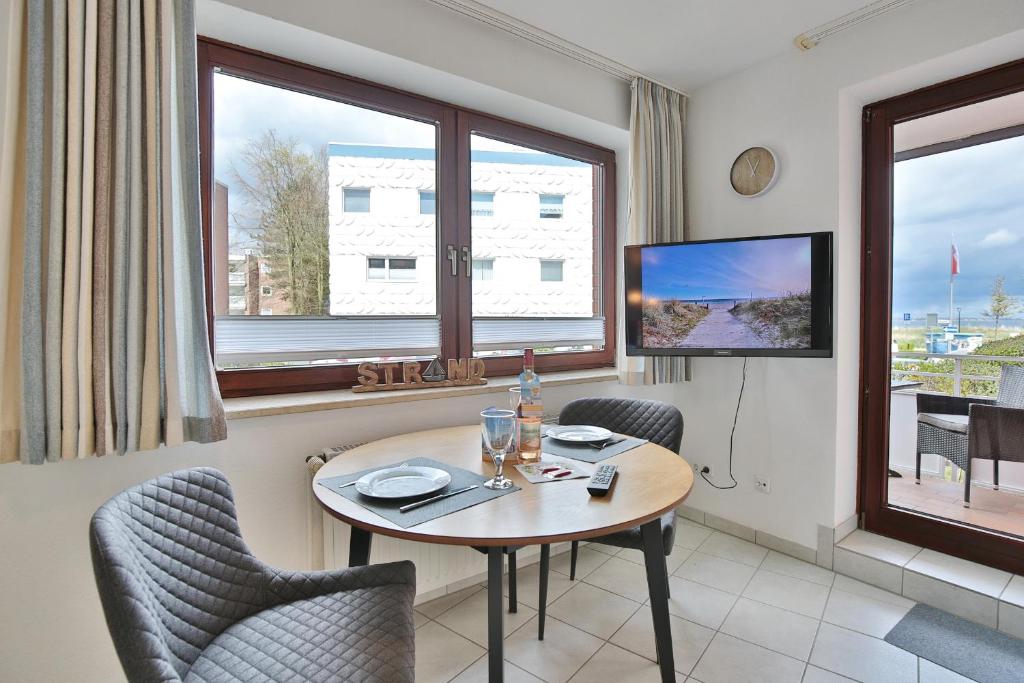 TV a/nebo společenská místnost v ubytování Strandburg Strandburg Appartement 1