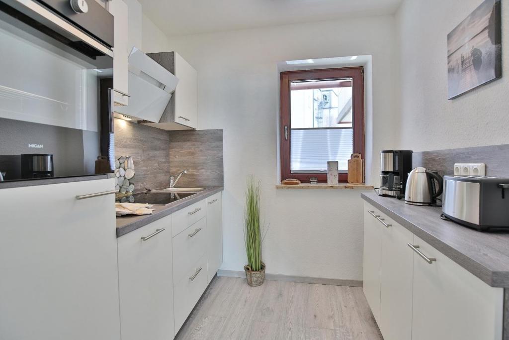 Kuchyň nebo kuchyňský kout v ubytování Strandburg Strandburg Appartement 1