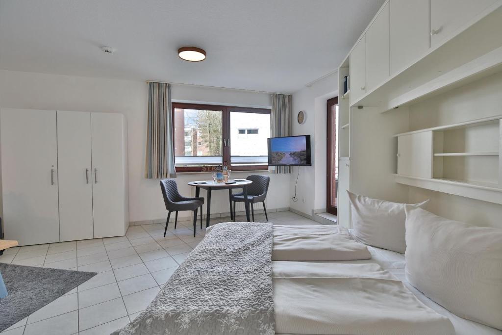 Postel nebo postele na pokoji v ubytování Strandburg Strandburg Appartement 1
