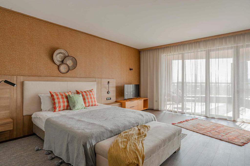 a bedroom with a large bed and a large window at WN LAB Hotel - inclusive breakfast, parking and coworking in Sofia