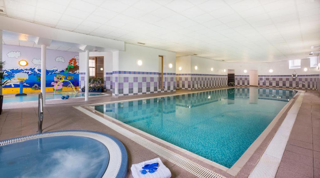 a large swimming pool in a hotel room at Maldron Hotel Shandon Cork City in Cork