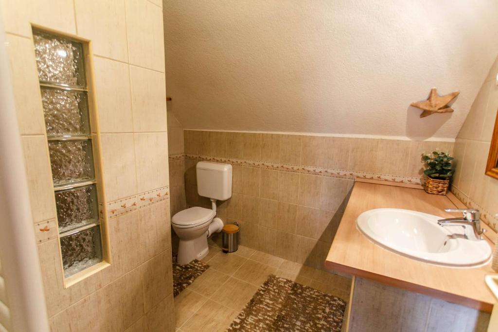 Koupelna v ubytování LiBe Apartman