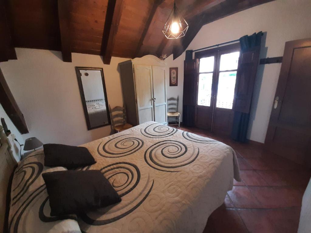 Postel nebo postele na pokoji v ubytování Casa Graciano II