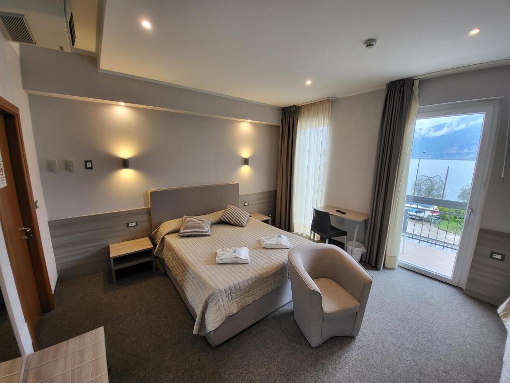 Postel nebo postele na pokoji v ubytování Hotel Garni Rosmari