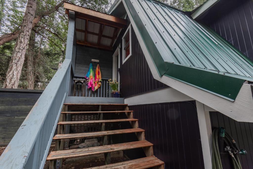 a staircase leading up to a tiny house at Salt Spring Carriage House B&B in Ganges