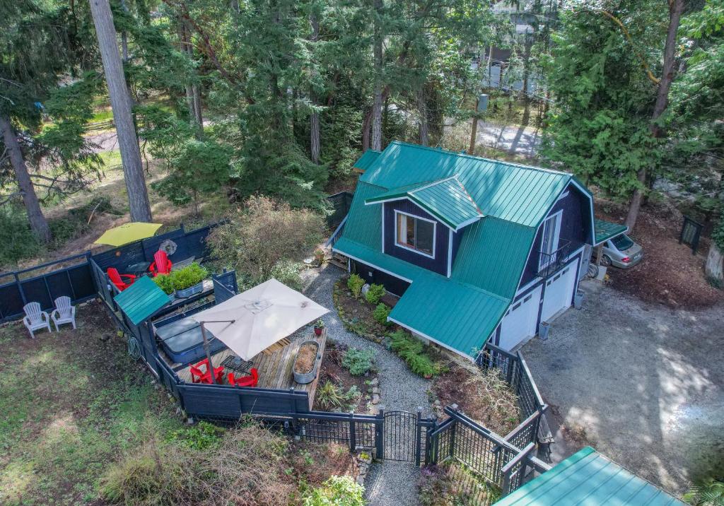 an overhead view of a tiny house with a green roof at Salt Spring Carriage House B&B in Ganges