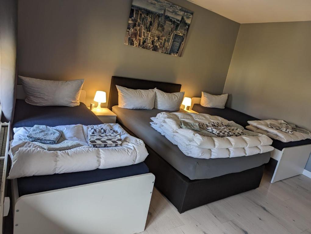 two beds sitting next to each other in a room at Flensburg Zentrum 69 02 in Flensburg