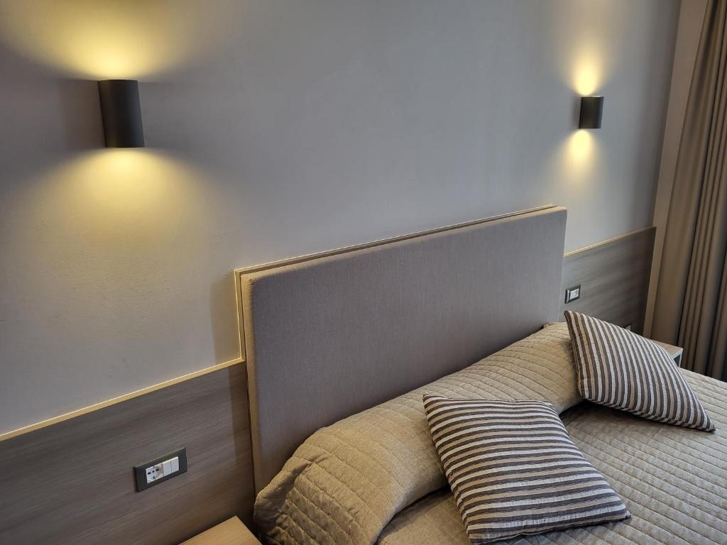Postel nebo postele na pokoji v ubytování Hotel Garni Rosmari