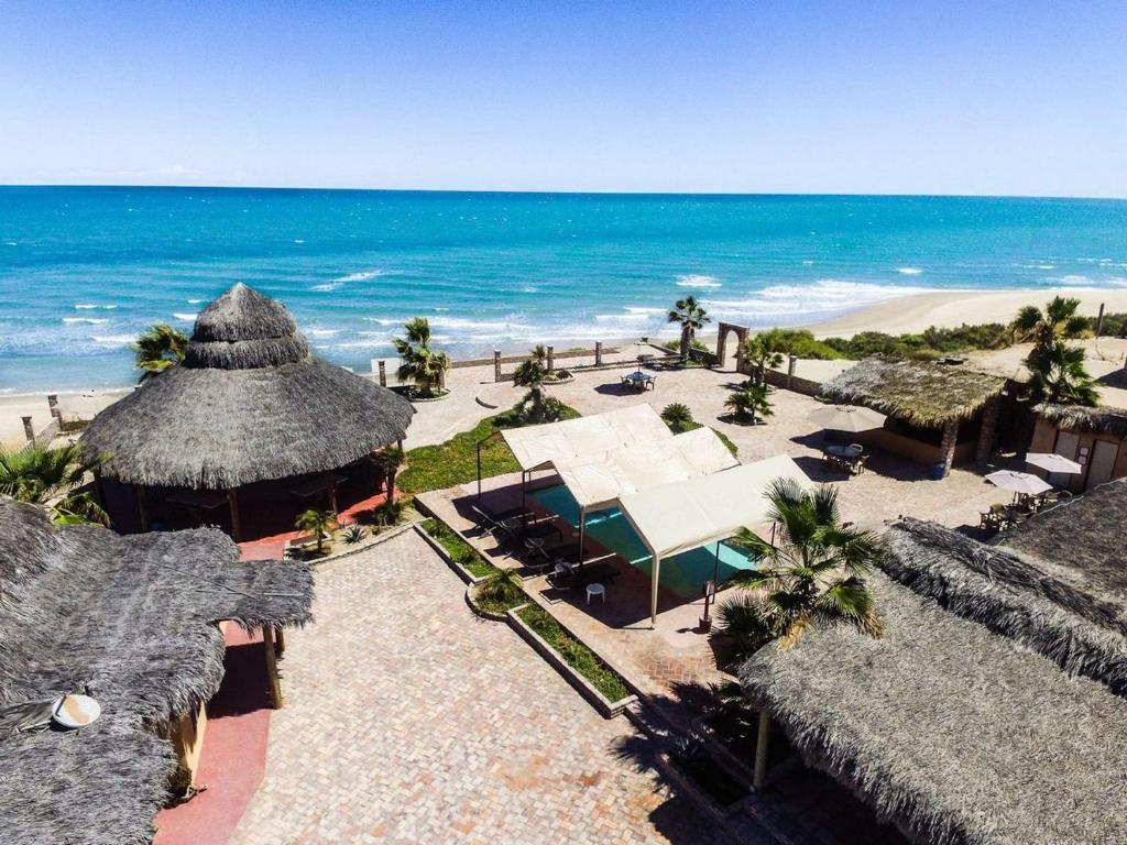 an aerial view of a beach with umbrellas and the ocean at Little Slice of Heaven - Amazing San Felipe Beach Rental in Don Pancho