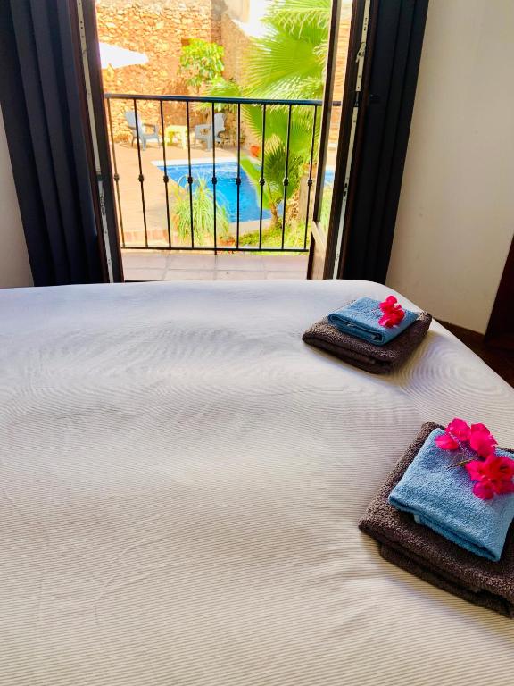 Postel nebo postele na pokoji v ubytování Boutique Hostal Lorca