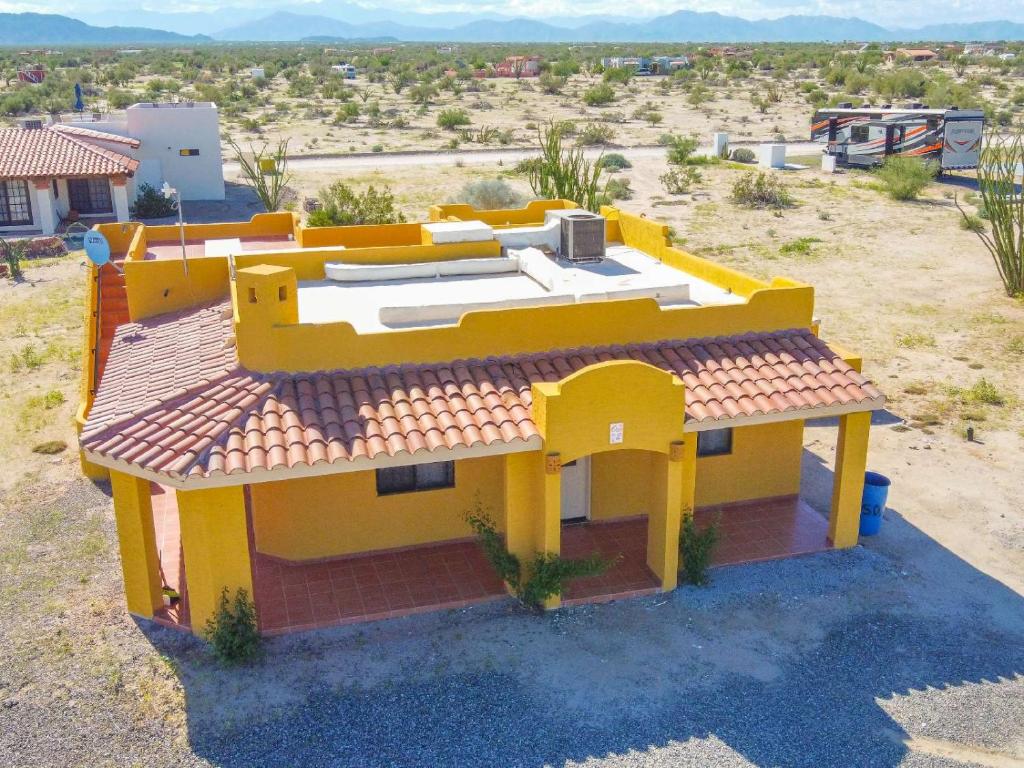 a model of a yellow house in the desert at 2BR /2BA Family Vacation Home with WiFi in Playa Hawaii