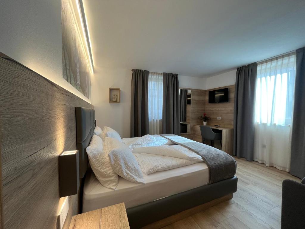 Postel nebo postele na pokoji v ubytování Le Rocce Val di Non - Quality Room & Breakfast