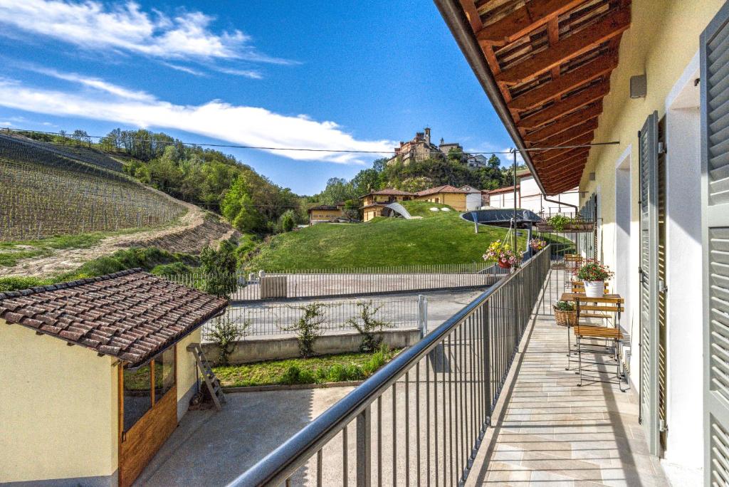 a balcony of a house with a view of a hill at Ciabot delle Aie - Barolo in Barolo
