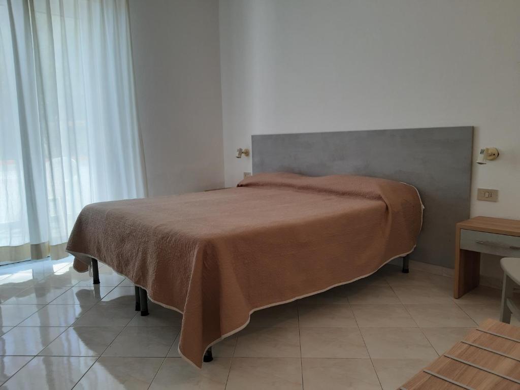 Letto o letti in una camera di Cocos Park Ischia