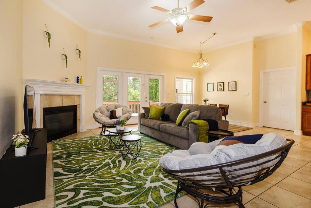 a living room with a couch and a fireplace at Cozy Home on the outskirts of Tallahassee in Tallahassee