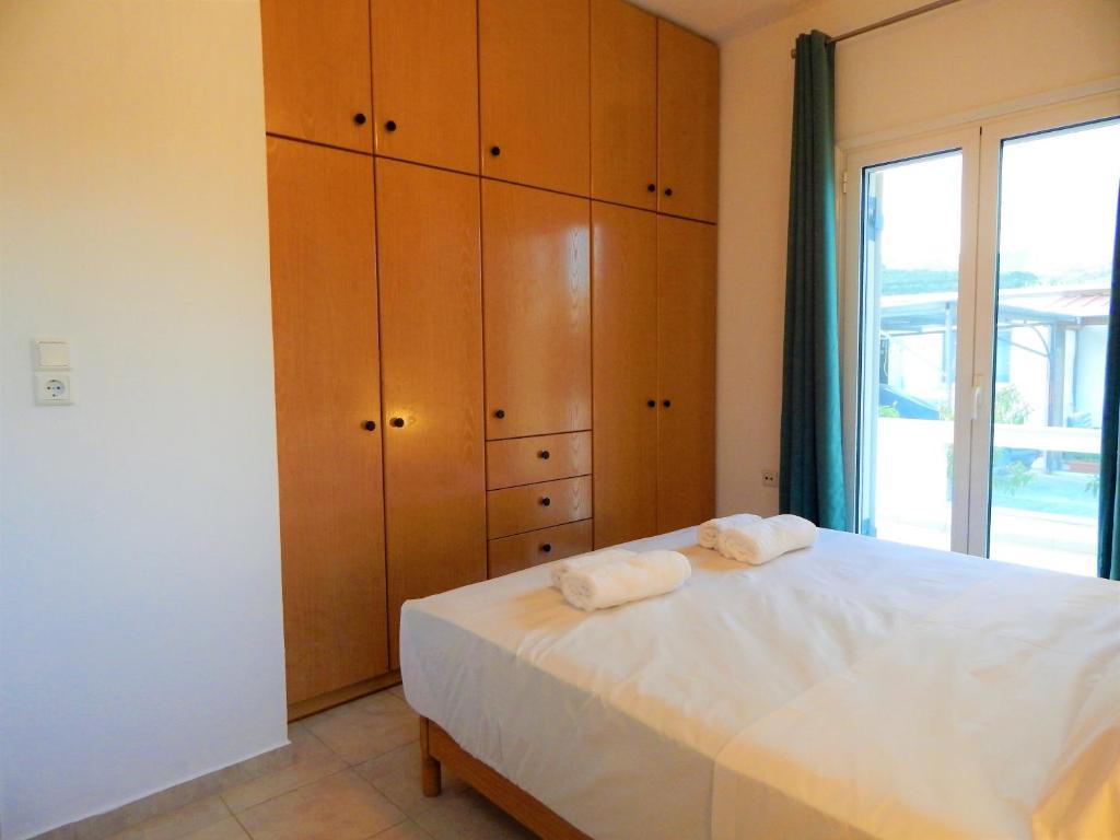 Postel nebo postele na pokoji v ubytování Villa Evridiki