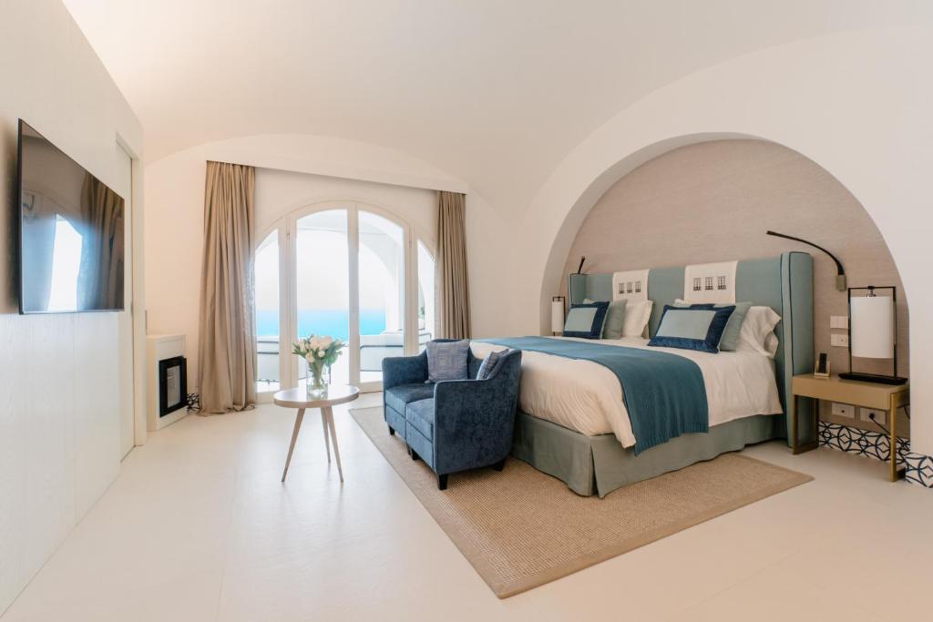 Postel nebo postele na pokoji v ubytování Palazzo M Capri