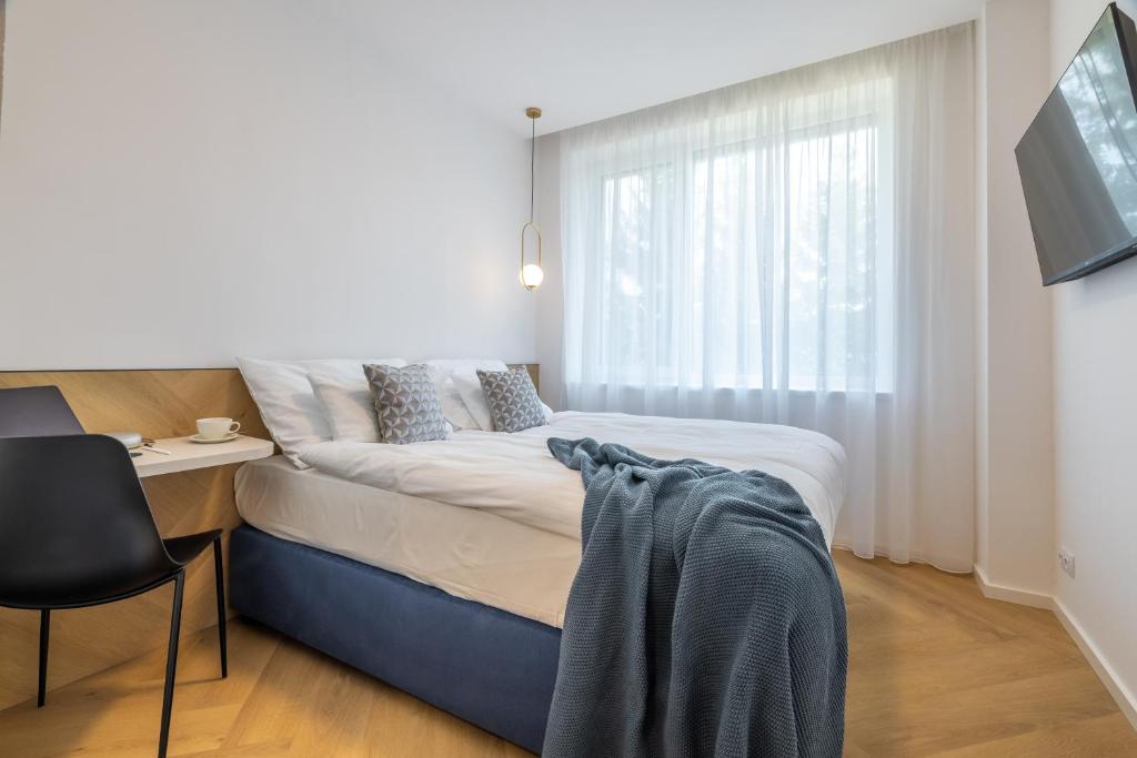 Postel nebo postele na pokoji v ubytování Resort Český les