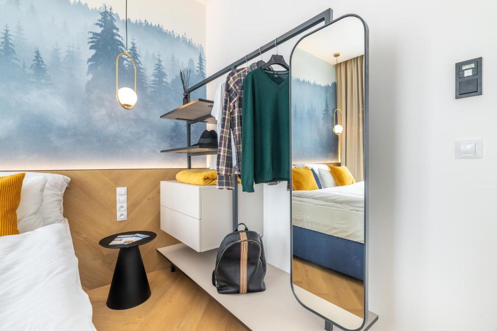 Postel nebo postele na pokoji v ubytování Resort Český les