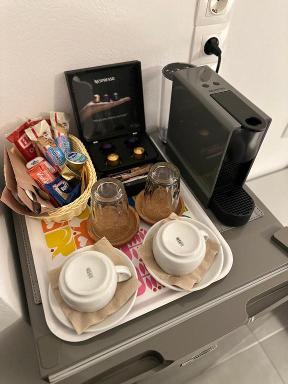 Televiisor ja/või meelelahutuskeskus majutusasutuses Kamelia Hotel