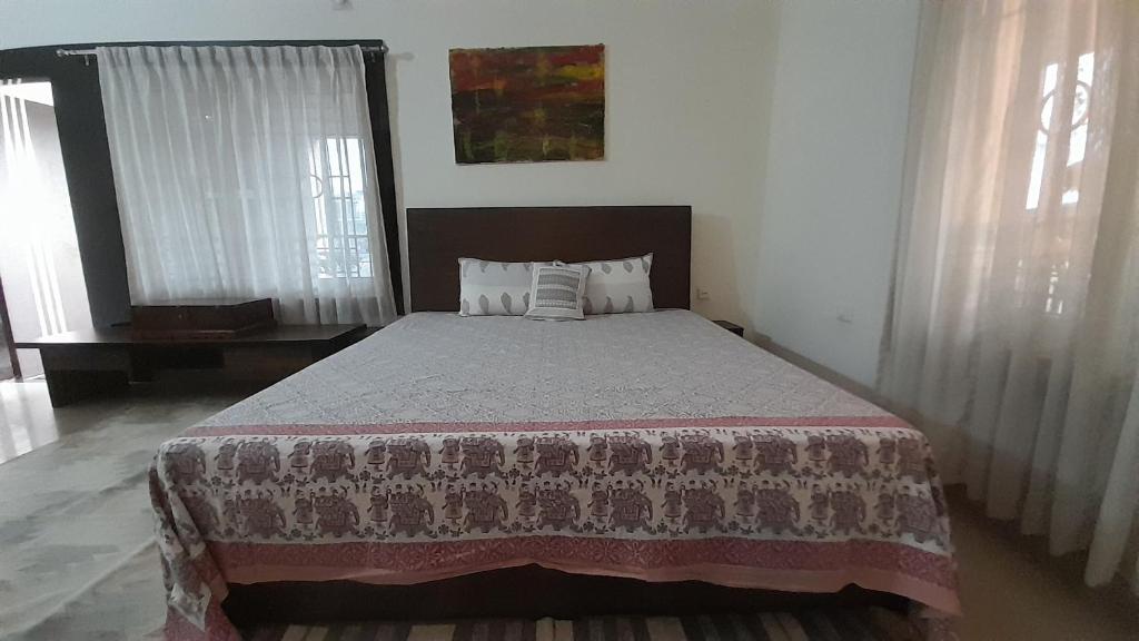 Postel nebo postele na pokoji v ubytování Sublime Homestay