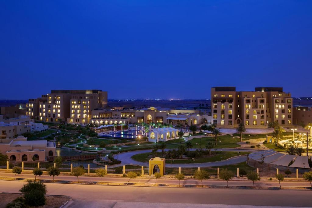 a view of a city at night at InterContinental Durrat Al Riyadh Resort & Spa, an IHG Hotel in Riyadh