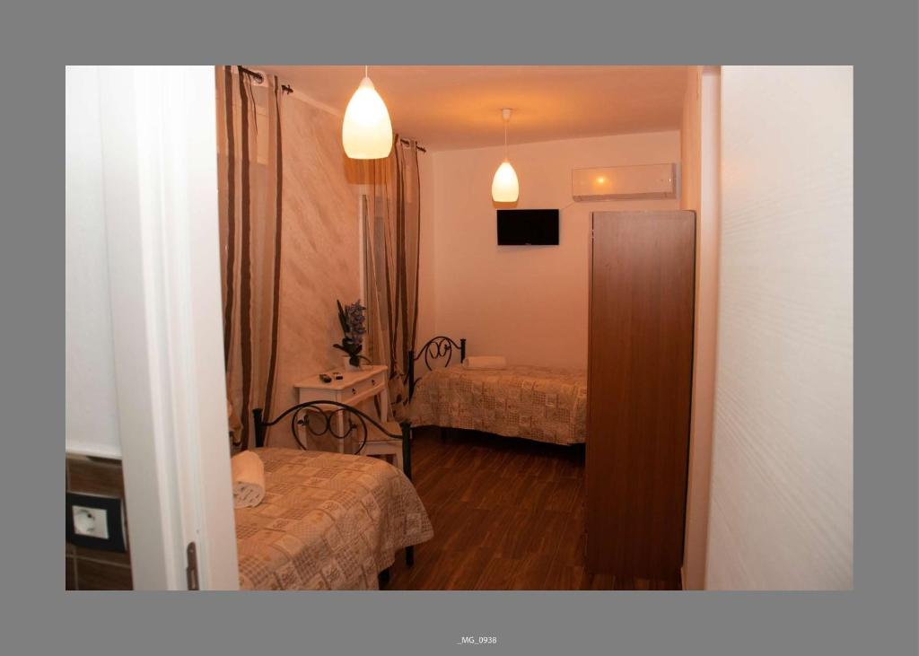 Postel nebo postele na pokoji v ubytování B&B Pastello