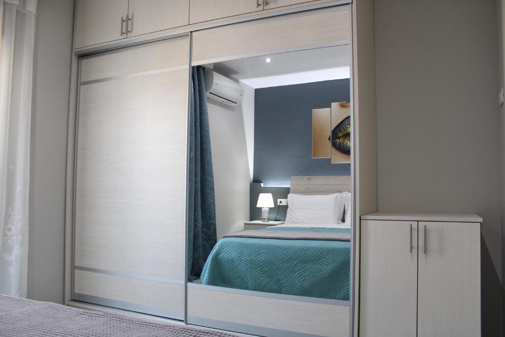 Postel nebo postele na pokoji v ubytování MAXIM APARTMENT