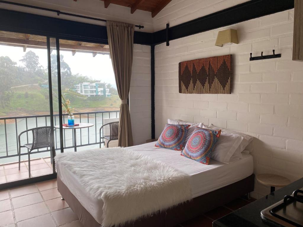 Postel nebo postele na pokoji v ubytování Ecolodge Bahia del Peñón