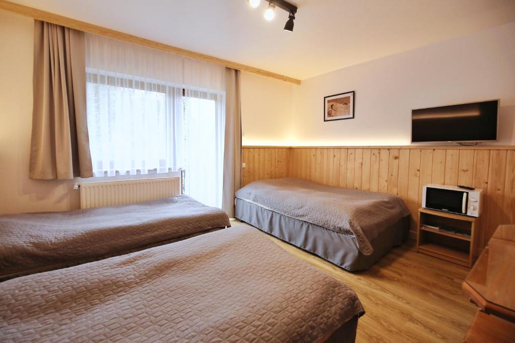 Posteľ alebo postele v izbe v ubytovaní Pokoje Gościnne Stanek
