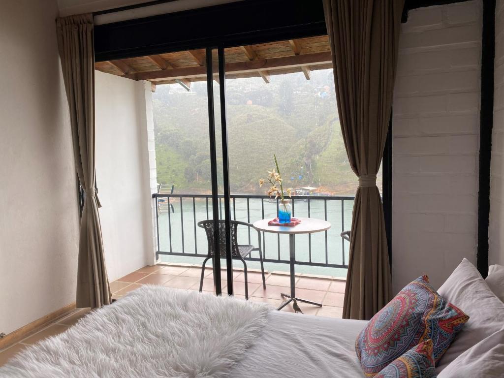 Postel nebo postele na pokoji v ubytování Ecolodge Bahia del Peñón