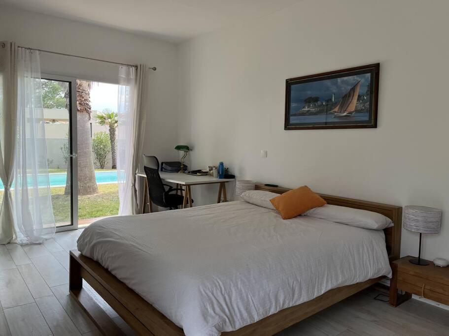Posteľ alebo postele v izbe v ubytovaní Villa avec magnifique piscine et grand jardin, à 2 pas du golf et de la plage