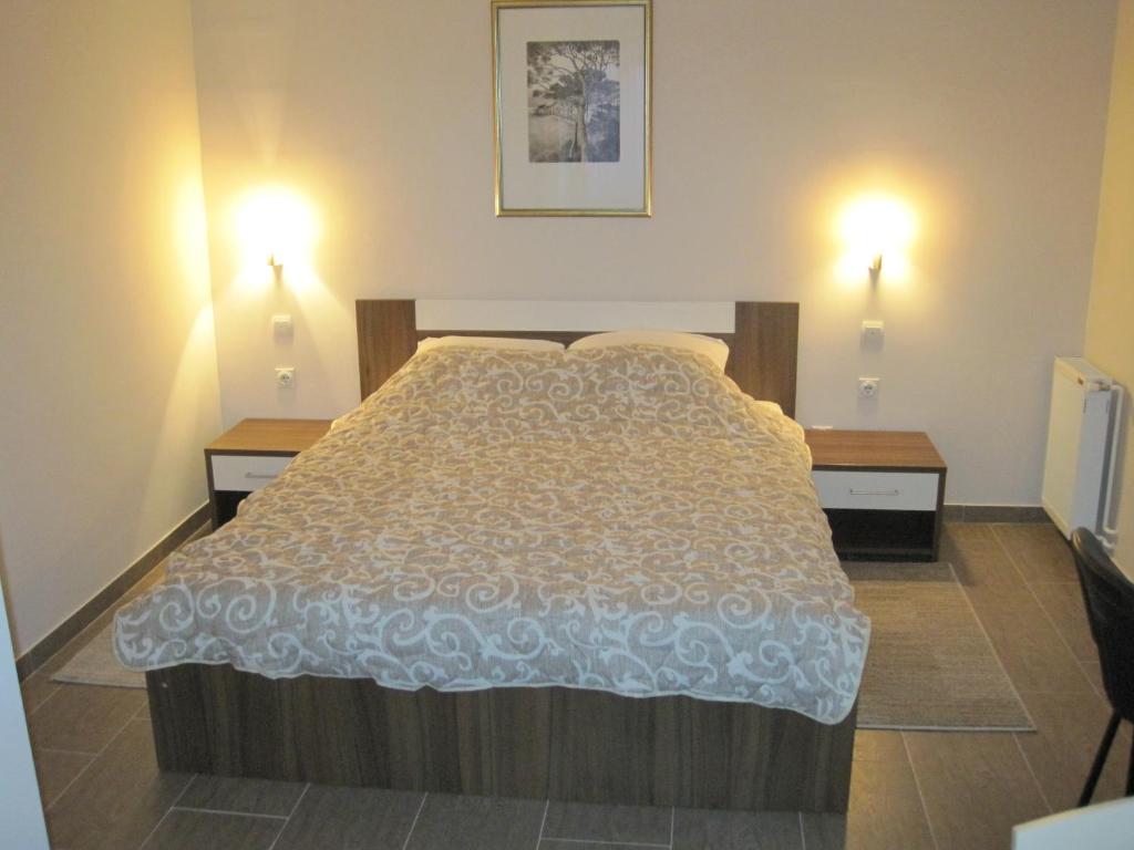 Postel nebo postele na pokoji v ubytování Medijana Apartments Niš