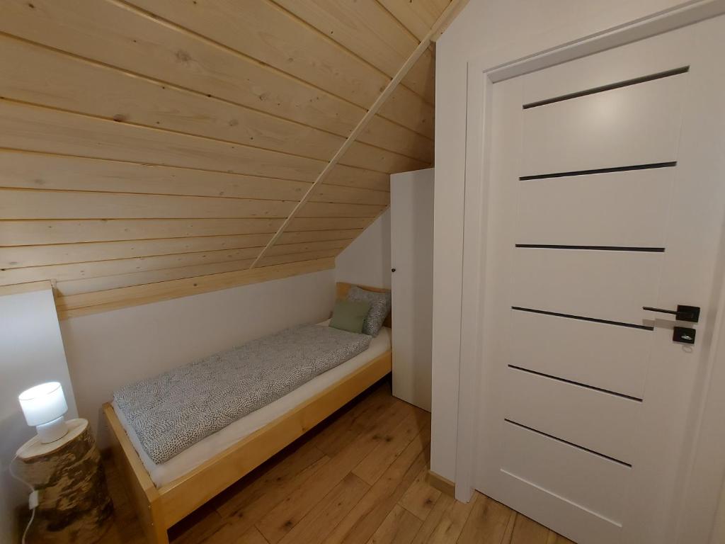 Postel nebo postele na pokoji v ubytování Domki na Stoku