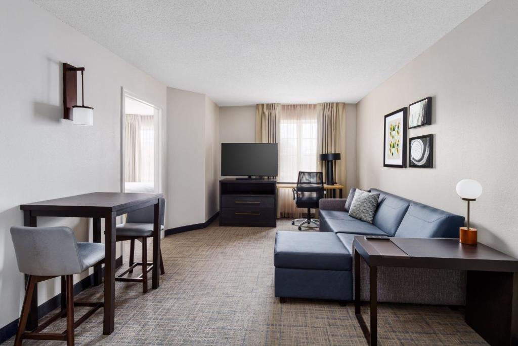 a living room with a couch and a table at Residence Inn Hartford Rocky Hill in Rocky Hill