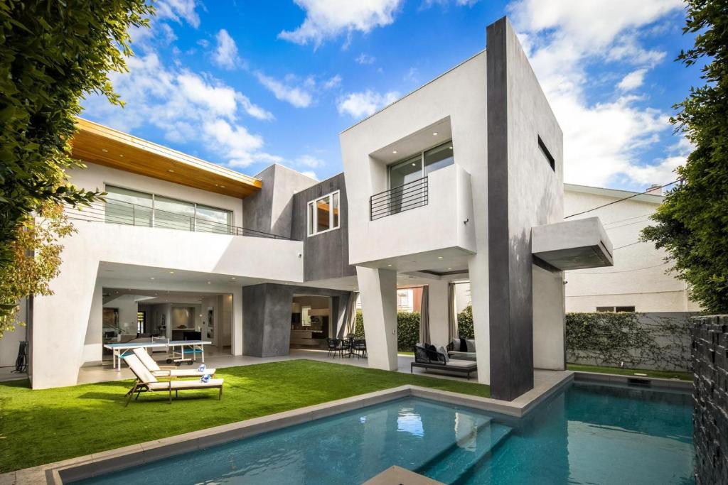 a house with a swimming pool in front of it at Alfred Villa in Los Angeles