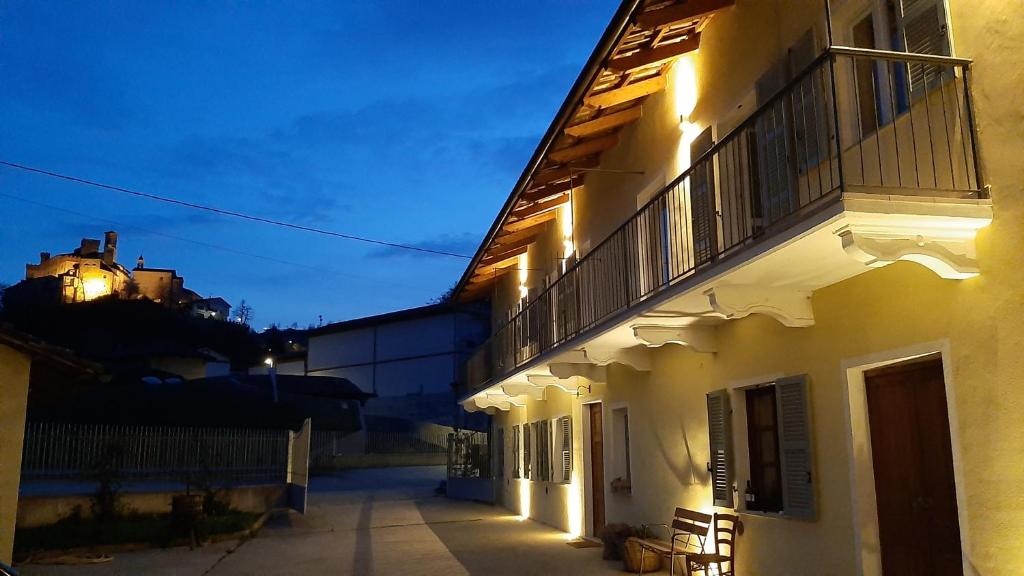 a white building with lights on the side of it at Ciabot delle Aie - Barolo in Barolo