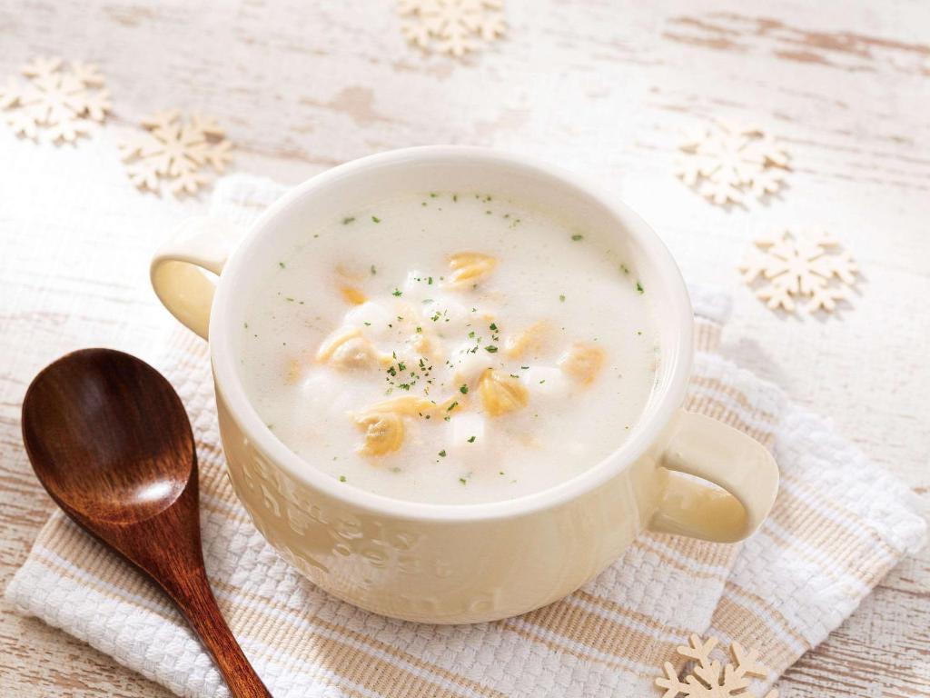 a white cup of soup with macaroni and cheese at Comfort Hotel Central International Airport in Tokoname